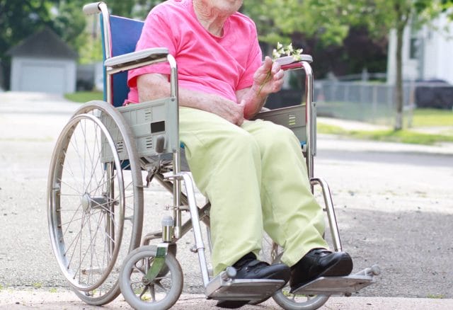 Woman seated in a wheelchair