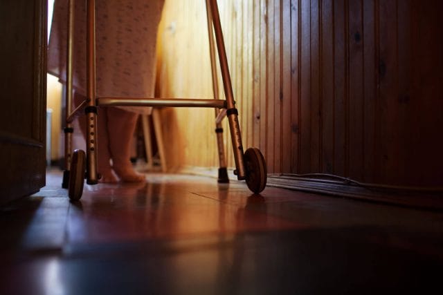 lower portion of a woman using a walker